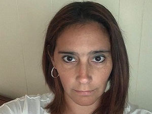 Headshot of brunette woman.